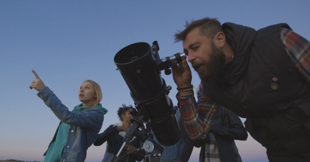 Looking through telescope