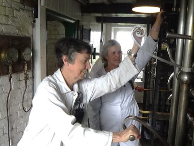 Two volunteers on driving platform